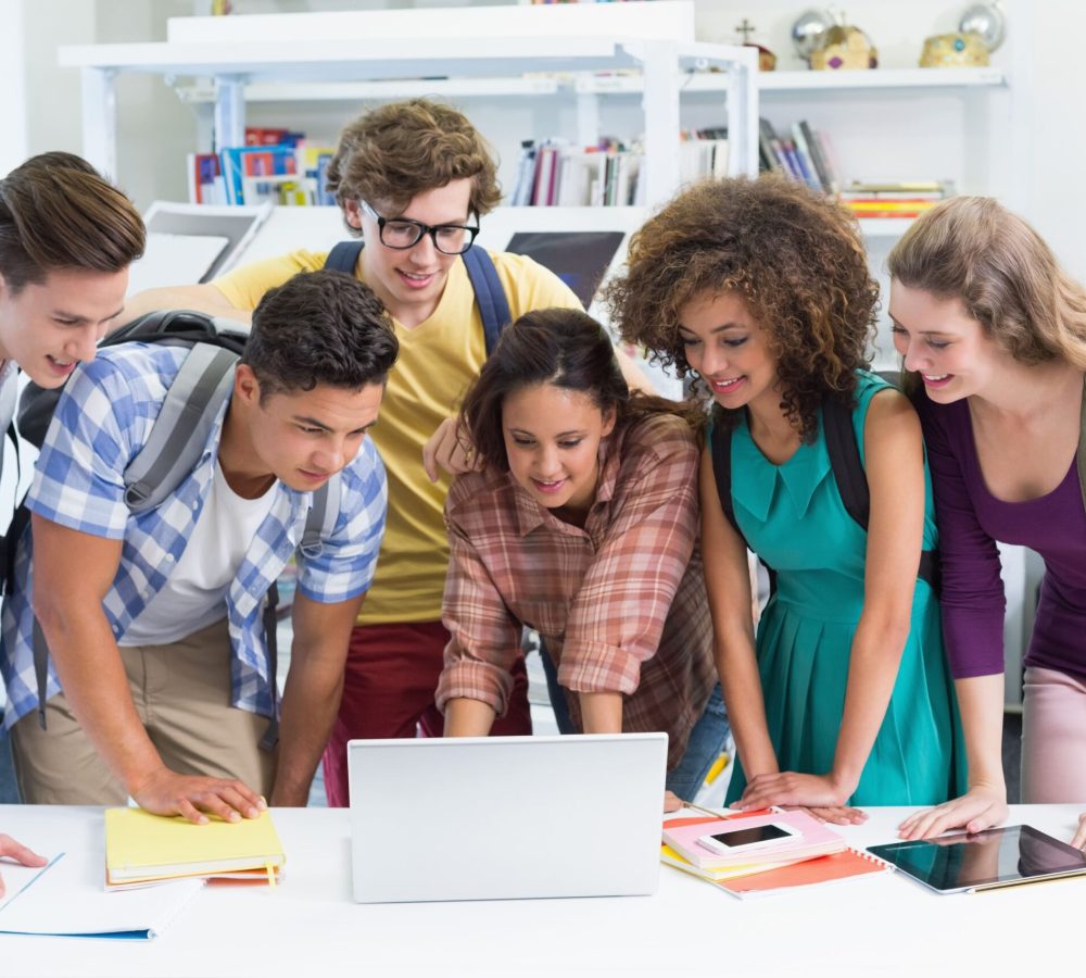 happy-students-working-together-laptop (1)